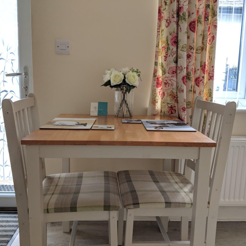 The dining table at Beech Lynette, laid with flowers